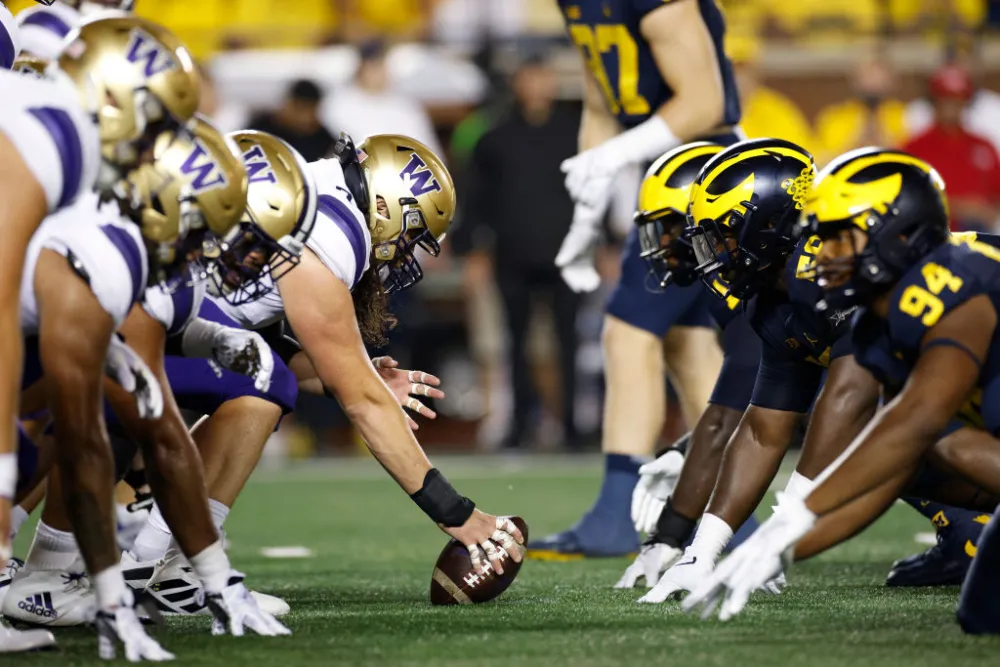 Michigan wolverines football vs washington huskies football match 